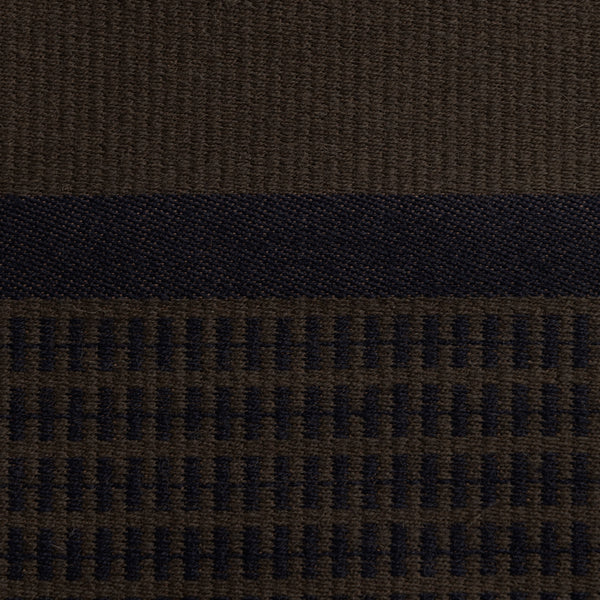 Close-up of the dark brown Danish woven wool fabric from Kjellerup Væveri, featuring a distinctive checkered pattern. The fabric showcases a blend of brown and blue tones, reflecting the exquisite craftsmanship and refined texture characteristic of Kjellerup Væveri's designs, used in the Kelly Rutherford Limited Edition Collection by August Sandgren.